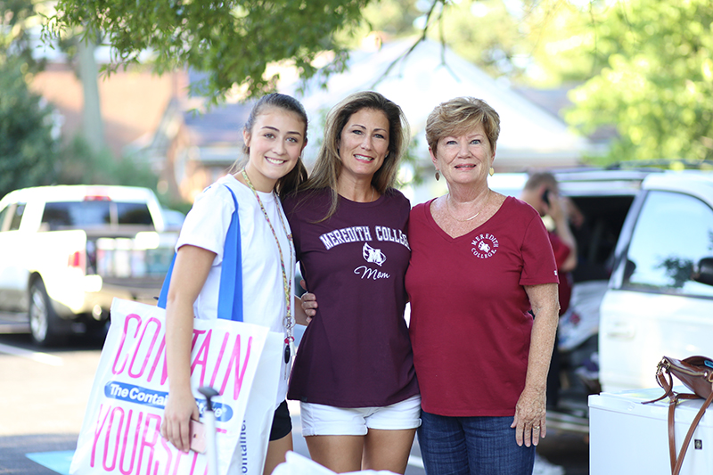 Mother, Daughter and Grandmother smiling for photo on Move in Day