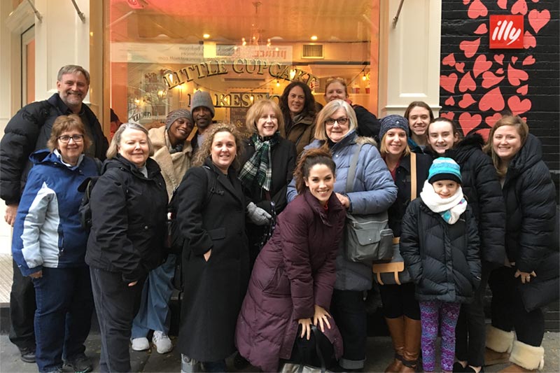 Alumnae NY Trip 2018 - Alumnae posting in front of the Little Cake Bakeshop