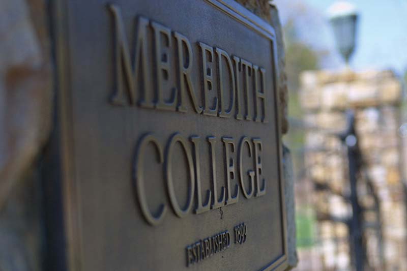 Plaque at the front gate that says "Meredith College. Established 1899".
