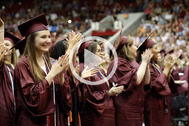 Click image of students in commencement regalia  to watch 2018 Commencement Highlights