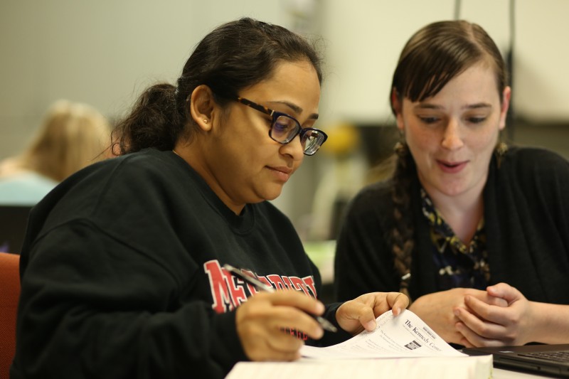 Image of two students studying.
