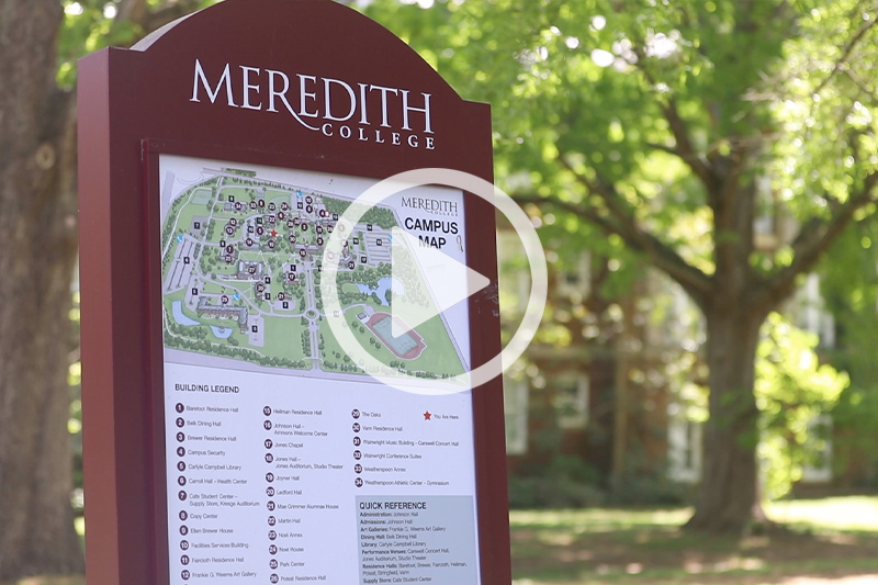 Click image of Meredith College Campus Map Sign with trees visible in background to watch movie in modal