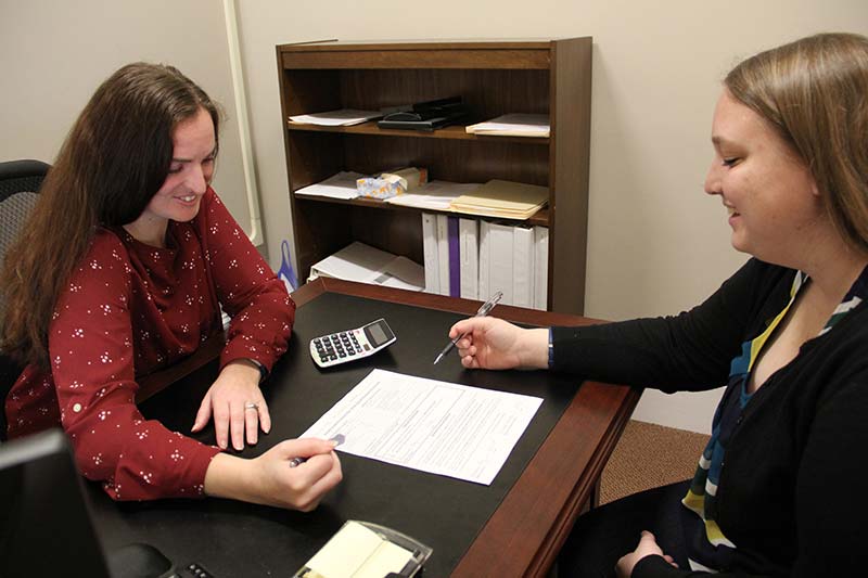 Student in consultation with financial aid staff member