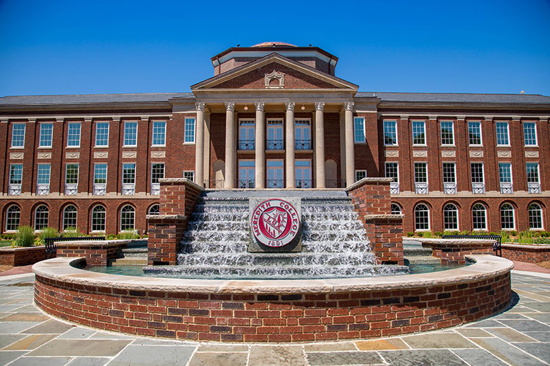 Image of Johnson Hall with the stairs fountain out front.