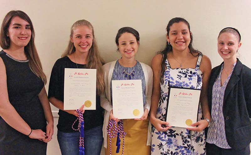 Three Meredith students inducted into Pi Delta Phi.