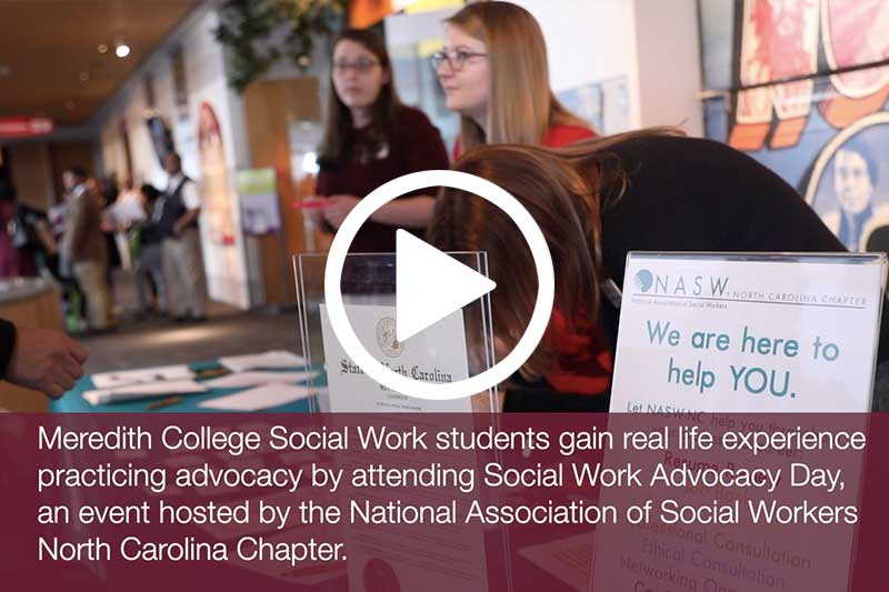 Click on image of students at display table during Social Work Advocacy Day to watch video in modal