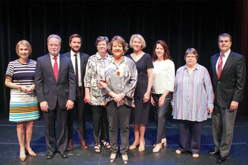 Dr Allen and Alumnae Award Recipients standing on Jones Auditorium Stage
