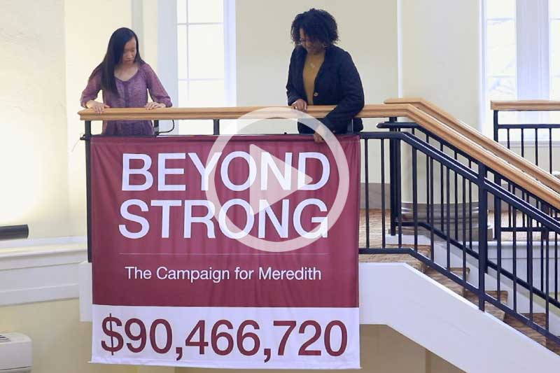 Click on image of students holding Beyond Strong Banner to view the movie in a modal