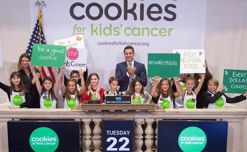 Cookies for Kids' Cancer group ringing the bell.