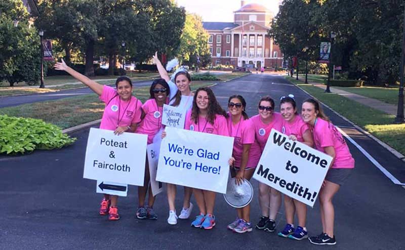 Orientation Crew members cheer arriving students on Move-In Day
