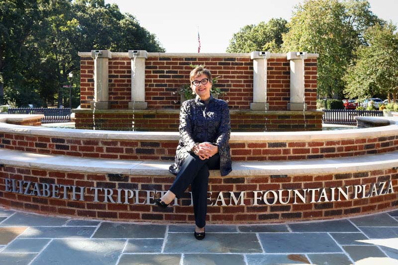 Donor Elizabeth Beam sits in front of the Elizabeth Triplett Beam Fountain Plaza