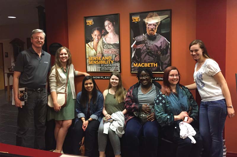 A group photo of Dr. Garry Walton and the six students that went on the trip inside one of theatres