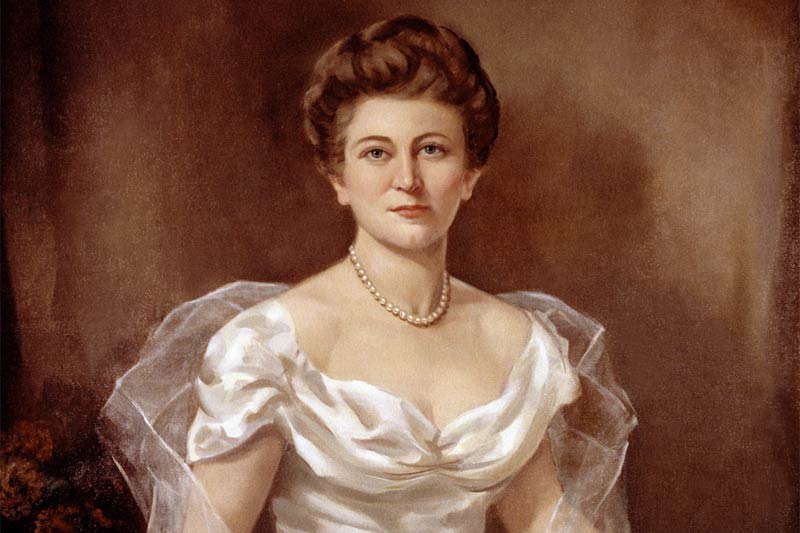 Lettie Pate in a painting with a white dress and brown background.