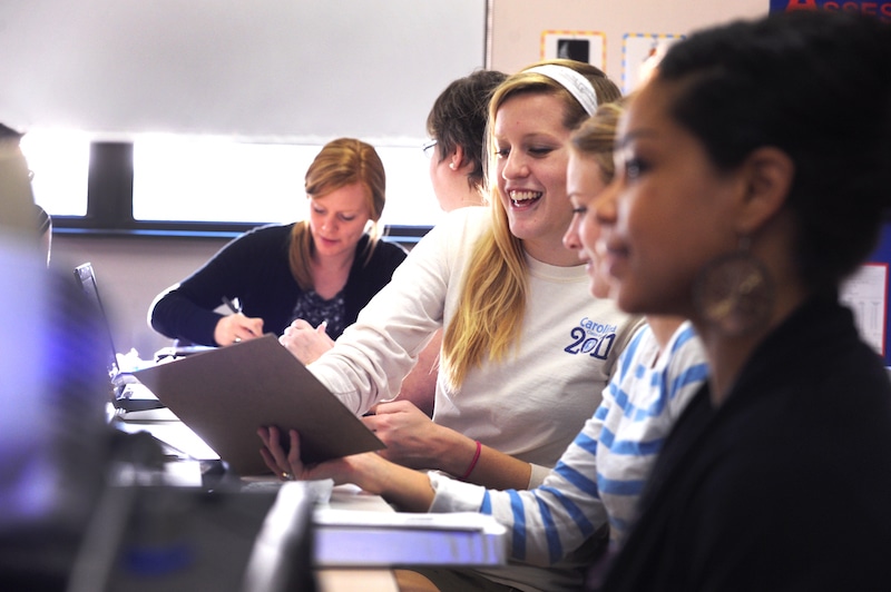 Graduate education students working in a classroom.