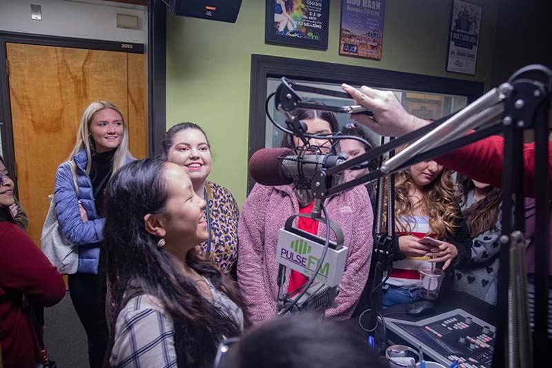 Comm Students at radio station.