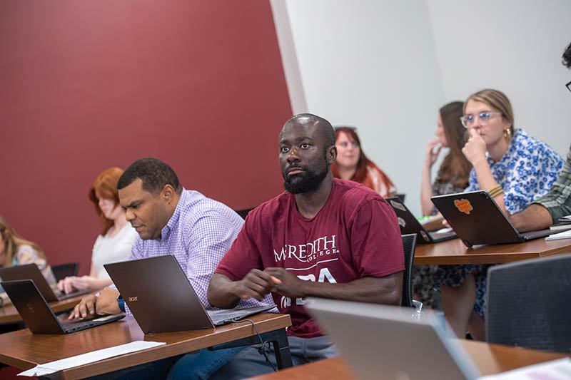 Students pay attention during an MBA class.