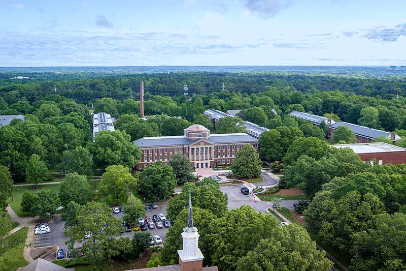 Arial view of Johnson Hall and surrounding campus beauty.