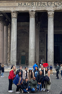 Students outside of an historical site in Italy.