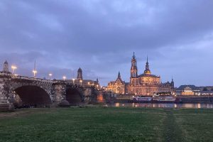 Dresden, Germany bridge over a river at dusk.
