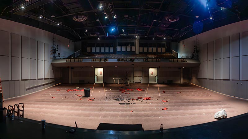 Jones Auditorium interior with all of the old red chairs removed.