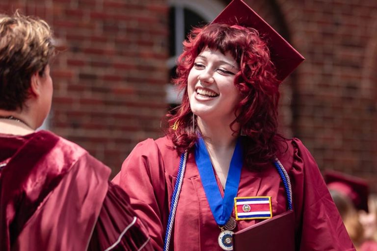 PKP Member receiving diploma at Commencement 2024