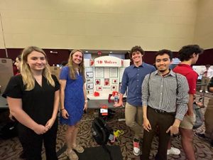 ۲ӰԺ Student in Blue Dress Emily Lewis and NCSU Students