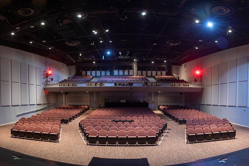 Jones Auditorium from the stage looking into the audience seating areas and balcony.