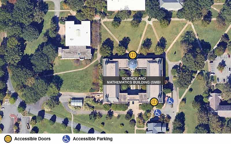 Google earth view of the Science and Math building with icons showing accessible doors and accessible parking.